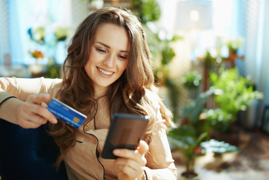 woman in sunny day making online shopping on e-commerce website